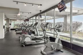 Skokie apartment for rent - A gym with treadmills and elliptical machines.