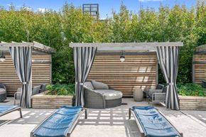 Chicago apartment for rent - A patio with a couch, chairs, and a slide.