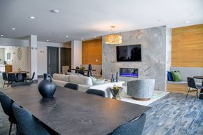 Gonzales apartment for rent - A modern dining room with a large table and chairs.