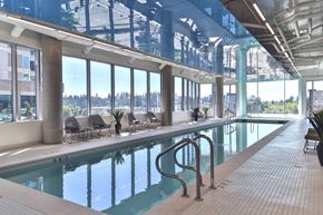 Bellevue apartment for rent - Large indoor swimming pool with a glass ceiling at Soma Towers apartments for rent in Bellevue, WA.