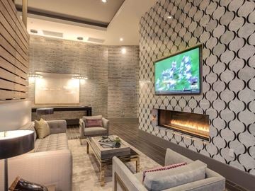 Glendale apartment for rent - A modern living room with a television and a fireplace.