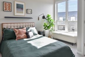 Hopkins apartment for rent - One Bedroom Luxury Apartments in Hopkins, MN - The Hallon - Furnished Bedroom with Plush Carpet Flooring and an Oversized Window