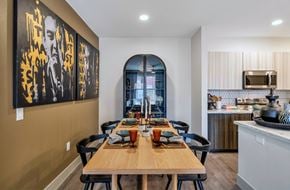 Chandler apartment for rent - A dining room with a wooden table set for a meal.