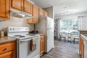 Jonesboro apartment for rent - Kitchen with view of the dining area at Monterey Village apartments for rent in Jonesboro, Georgia.