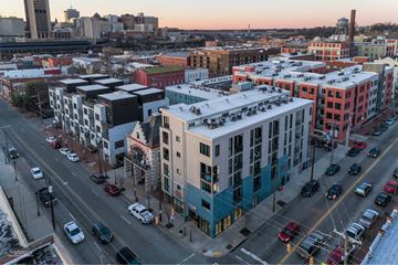 Richmond apartment for rent - A city street with cars and buildings.