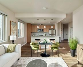 West New York apartment for rent - A modern kitchen with a dining table set for four.