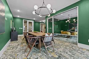 Fort Worth apartment for rent - A dining room with a wooden table and chairs.