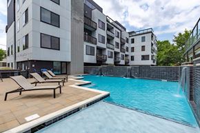 Richmond apartment for rent - A swimming pool in front of apartment buildings.