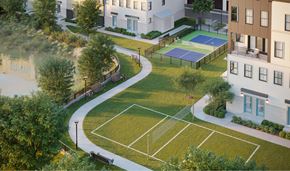 Sterling apartment for rent - A tennis court is surrounded by apartment buildings.