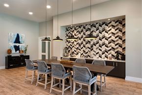 Brandywine apartment for rent - Community clubhouse with modern dining room with a wooden table and grey chairs at Brandywine Green, Maryland, 20613