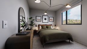 West Hollywood apartment for rent - A bedroom with a large bed and a view of the outdoors through a window.