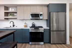 West Hollywood apartment for rent - A modern kitchen with a stove top oven and a refrigerator.