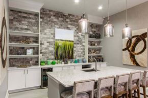 Mt. Pleasant apartment for rent - A kitchen with a white countertop and a stone wall.
