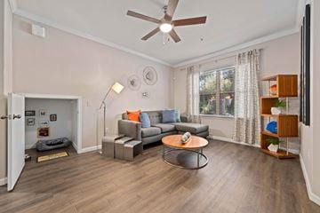 Peoria apartment for rent - A living room with a grey couch and a coffee table.