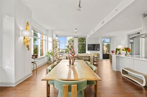 Charlotte apartment for rent - A dining room with a wooden table and green chairs.