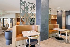Seattle apartment for rent - A modern dining area with a wooden table and chairs.