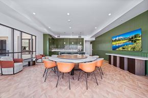 Los Angeles apartment for rent - A modern dining room with a large table and chairs.