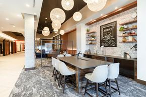 Alexandria apartment for rent - A modern kitchen with a dining table and chairs.