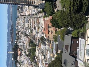San Francisco apartment for rent - A cityscape with buildings of various heights and a bridge in the background.