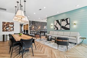 Charlotte apartment for rent - A modern dining room with a wooden table and chairs.