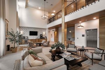 Austin apartment for rent - A living room with a white sofa and a wooden coffee table.