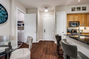 Houston apartment for rent - A kitchen with a dining table and chairs.