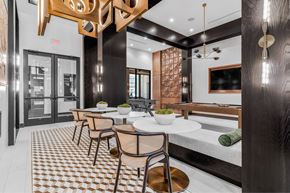 Richardson apartment for rent - A modern dining room with a checkered floor and a wooden table.