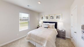 Fountain Inn apartment for rent - A bedroom with a large bed and a window with blinds.