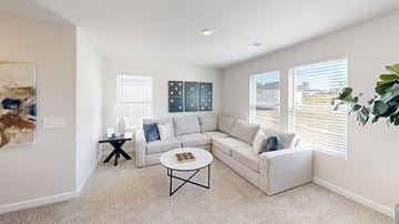 Fountain Inn apartment for rent - A living room with a white couch, a coffee table, and a painting on the wall.