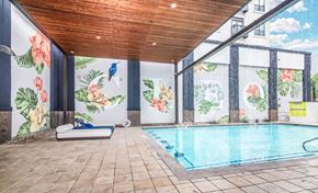 Dallas apartment for rent - A pool inside a room with a wooden ceiling.