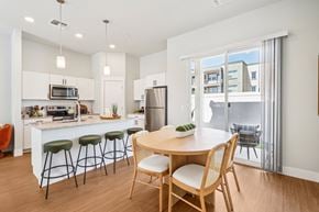 Queen Creek apartment for rent - A modern kitchen with a dining table and chairs.