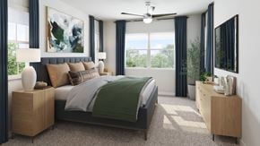 Queen Creek apartment for rent - A bedroom with a large bed and a ceiling fan.