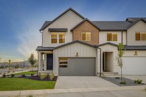 Herriman apartment for rent - A modern house with a garage and a driveway.