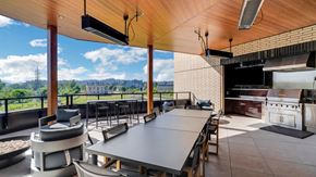 Eugene apartment for rent - A modern outdoor dining area with a view of the city.