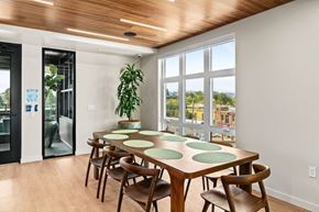 Eugene apartment for rent - A dining room with a wooden table and chairs.