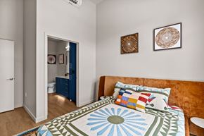 Eugene apartment for rent - A bedroom with a bed and two pictures on the wall.