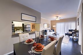 Lakewood apartment for rent - A modern dining room with a black table set for two.