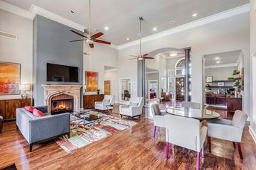 Stafford apartment for rent - A living room with a grey couch and a fireplace.