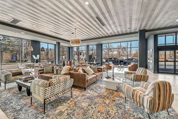 Highland Park apartment for rent - A living room with a patterned rug and striped chairs.