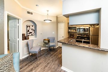Houston apartment for rent - A kitchen area with a table and chairs.