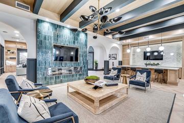 Grand Prairie apartment for rent - A modern living room with a glass backed television and a fireplace.