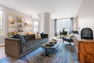 Dallas apartment for rent - A living room with a brown sofa and a coffee table.