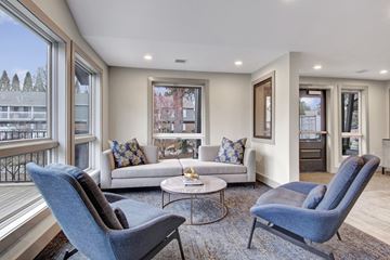Beaverton apartment for rent - A living room with a blue chair and a white couch.
