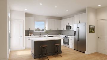 Humble apartment for rent - A modern kitchen with white cabinets and stainless steel appliances.
