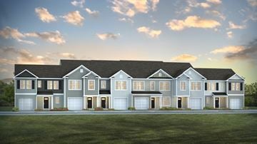 Summerville apartment for rent - A large, modern house with a grey and white exterior and multiple garages.