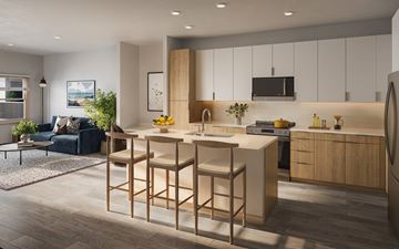 Littleton apartment for rent - A modern kitchen with a bar stool and a dining table.