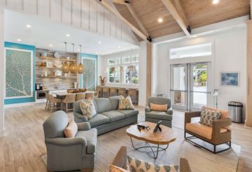 Charleston apartment for rent - A spacious living room with a grey sofa set and a wooden coffee table.