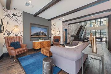 Glendale apartment for rent - A living room with a brown leather chair and a grey sofa.