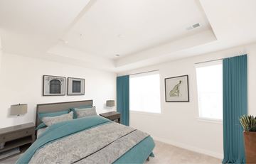 Owings Mills apartment for rent - A bedroom with a large bed and two windows.