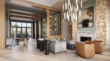 Charlotte apartment for rent - A modern living room with a fireplace and a large painting on the wall.
